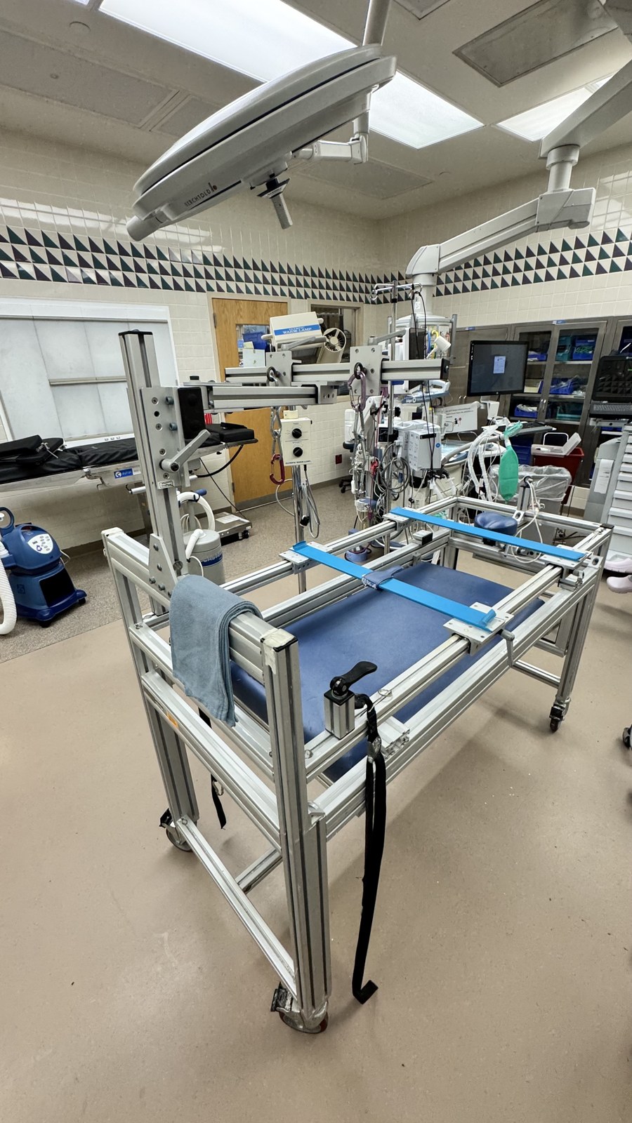 EDF / Mehta serial casting frame ("the table") — radiolucent aluminum frame with adjustable head/traction upright and suspension slings (Pillar Orthopedic Design, Vancouver WA)